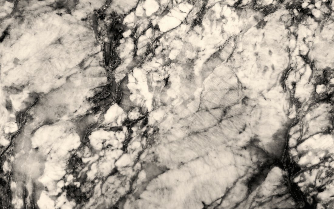Close-up of a polished mitered countertop edge with a fine gold seam line