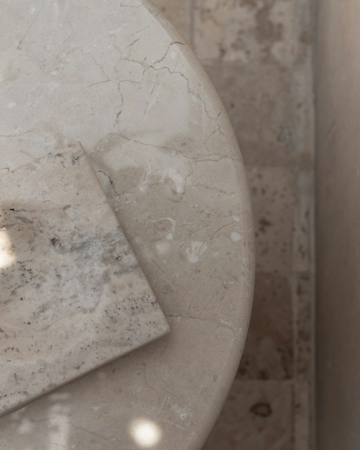 Marble slab samples on the templating table at the Pacific Range Counter Top fabrication shop in Vancouver